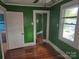 Bedroom with hardwood floors and green walls at 29 Willow St # 31, Badin, NC 28009
