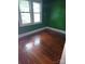 Bedroom with hardwood floors and green walls at 29 Willow St # 31, Badin, NC 28009