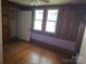 Bedroom with two windows and wood paneling at 29 Willow St # 31, Badin, NC 28009