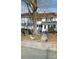 Traditional two-story home with white siding, blue shutters, and a brick-lined front yard with large tree at 29 Willow St # 31, Badin, NC 28009