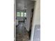Functional laundry area with washer hookup, utility sink, and durable flooring at 29 Willow St # 31, Badin, NC 28009