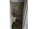 The bathroom features tile flooring and a tiled walk-in shower and sink at 29 Willow St, Badin, NC 28009
