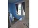 Bathroom featuring a toilet, sink, vanity with storage, and a window with natural light, creating a functional space at 29 Willow St, Badin, NC 28009