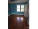 Spacious bedroom with hardwood floors, natural light, and ample closet space at 29 Willow St, Badin, NC 28009