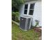 Exterior shot of a modern air conditioner unit outside of the home at 29 Willow St, Badin, NC 28009