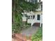 Home's front entrance with a brick retaining wall and sidewalk leading to the front door at 29 Willow St, Badin, NC 28009