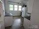 A kitchen with plenty of natural light from the large window at 29 Willow St, Badin, NC 28009