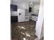 Traditional kitchen with white cabinets and updated appliances on brown flooring at 29 Willow St, Badin, NC 28009