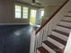 View of the living room and staircase at 29 Willow St, Badin, NC 28009
