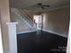 Spacious living room with black wood floors and open staircase at 29 Willow St, Badin, NC 28009