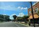 Charming street view with trees lining the sidewalks and brick buildings at 29 Willow St, Badin, NC 28009