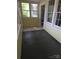 Bright sunroom featuring multiple windows offering ample natural light and views at 29 Willow St, Badin, NC 28009
