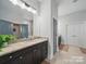 Bathroom with granite countertop, sink, and dark brown cabinets at 3007 Arsdale Rd, Waxhaw, NC 28173