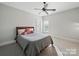 Comfortable bedroom featuring neutral walls, carpeted floors, and natural light from the window at 3007 Arsdale Rd, Waxhaw, NC 28173