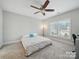 Bright bedroom with a ceiling fan and a large window allowing natural light at 3007 Arsdale Rd, Waxhaw, NC 28173