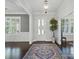 Elegant foyer with dark wood floors and a stylish light fixture at 3007 Arsdale Rd, Waxhaw, NC 28173