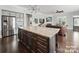 Open kitchen and living area with stainless steel appliances and granite countertops at 3007 Arsdale Rd, Waxhaw, NC 28173