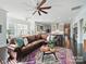 Spacious living room with a leather sectional and open layout at 3007 Arsdale Rd, Waxhaw, NC 28173