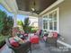 Inviting covered porch with comfortable seating and a ceiling fan at 3007 Arsdale Rd, Waxhaw, NC 28173