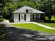 Charming bungalow with a well-manicured lawn and inviting front porch, perfect for enjoying the outdoors at 305 E Henry St, Belmont, NC 28012