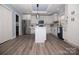Modern kitchen featuring stainless steel appliances, a center island, and pristine white cabinetry at 305 E Henry St, Belmont, NC 28012