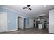 Spacious, open living area with sleek wood floors, and a peek into the modern updated kitchen at 305 E Henry St, Belmont, NC 28012