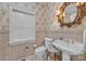 Charming bathroom with floral wallpaper, a pedestal sink, and a window allowing for natural light at 327 Saint Andrews Rd, Statesville, NC 28625