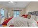 Bright bedroom featuring hardwood floors, a comfortable bed, and French doors leading to the backyard at 327 Saint Andrews Rd, Statesville, NC 28625
