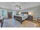 Spacious bedroom features natural light, hardwood floors, and elegant furnishings at 327 Saint Andrews Rd, Statesville, NC 28625