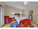 Charming bedroom featuring a cozy bed, stylish decor, and a ceiling fan for added comfort at 327 Saint Andrews Rd, Statesville, NC 28625