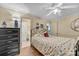 Cozy bedroom featuring a comfortable bed, ceiling fan, and adjoining bathroom at 327 Saint Andrews Rd, Statesville, NC 28625
