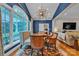 Elegant dining room featuring a large arched window and modern chandelier at 327 Saint Andrews Rd, Statesville, NC 28625