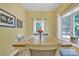 Cozy dining room showcasing a wood table, comfortable chairs, and bright windows at 327 Saint Andrews Rd, Statesville, NC 28625