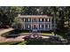 Stately two-story home featuring a red front door and large columns at 327 Saint Andrews Rd, Statesville, NC 28625