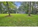 A sprawling green lawn surrounds this stately home with classic architecture at 327 Saint Andrews Rd, Statesville, NC 28625