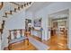 Charming foyer with wooden floors and staircase creates a welcoming entrance at 327 Saint Andrews Rd, Statesville, NC 28625
