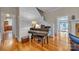 Elegant foyer with hardwood floors, a piano, and staircase leading to the upper level adds a touch of sophistication at 327 Saint Andrews Rd, Statesville, NC 28625
