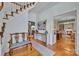 Bright foyer with staircase, hardwood floors, and views to the formal dining room and office at 327 Saint Andrews Rd, Statesville, NC 28625