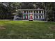 Exterior view of a traditional white home with a manicured front lawn at 327 Saint Andrews Rd, Statesville, NC 28625