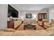 Bright living room featuring hardwood floors, modern decor, and comfortable furniture at 327 Saint Andrews Rd, Statesville, NC 28625