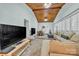 Open-concept living room featuring a wood ceiling, and a comfortable sectional sofa for relaxing and entertaining at 327 Saint Andrews Rd, Statesville, NC 28625