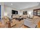Spacious living room with plush seating, a decorative rug, and contemporary decor at 327 Saint Andrews Rd, Statesville, NC 28625