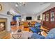 Open living room with a fireplace and view to dining area is an entertainer's dream at 327 Saint Andrews Rd, Statesville, NC 28625