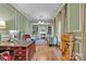 A spacious office with built-in bookshelves, fireplace, hardwood floors, and neutral colors at 327 Saint Andrews Rd, Statesville, NC 28625