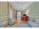 Inviting home office with natural light, a comfortable seating area, and ample workspace at 327 Saint Andrews Rd, Statesville, NC 28625