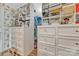 Custom walk-in closet with built-in shelving and drawers for ample storage at 327 Saint Andrews Rd, Statesville, NC 28625