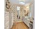Charming walk-in closet with custom shelving, drawers, a full-length mirror, and a window seat at 327 Saint Andrews Rd, Statesville, NC 28625