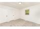 Clean bedroom with plush carpet, freshly painted walls, and a double door closet at 3724 Patricia Nw Dr, Concord, NC 28027