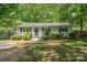 Charming single-story home with a well-maintained lawn and mature trees providing shade at 3724 Patricia Nw Dr, Concord, NC 28027