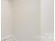 A view of a plain, neutral wall with an electrical outlet near the floor at 3724 Patricia Nw Dr, Concord, NC 28027
